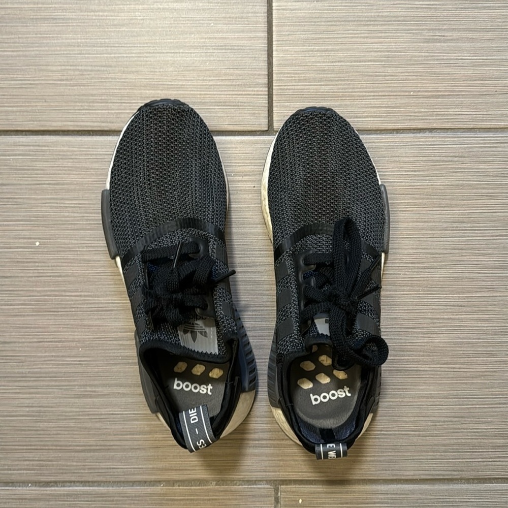 Black and Gray Adidas NMDs